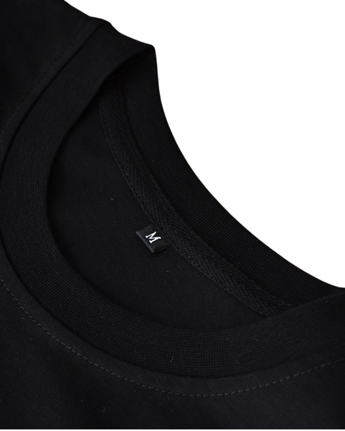 Black BP220 blank T-shirt, close-up of the inside collar and neck label