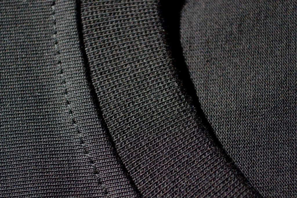 Close-up of the ribbed neckline on the black BP220 heavyweight cotton tee