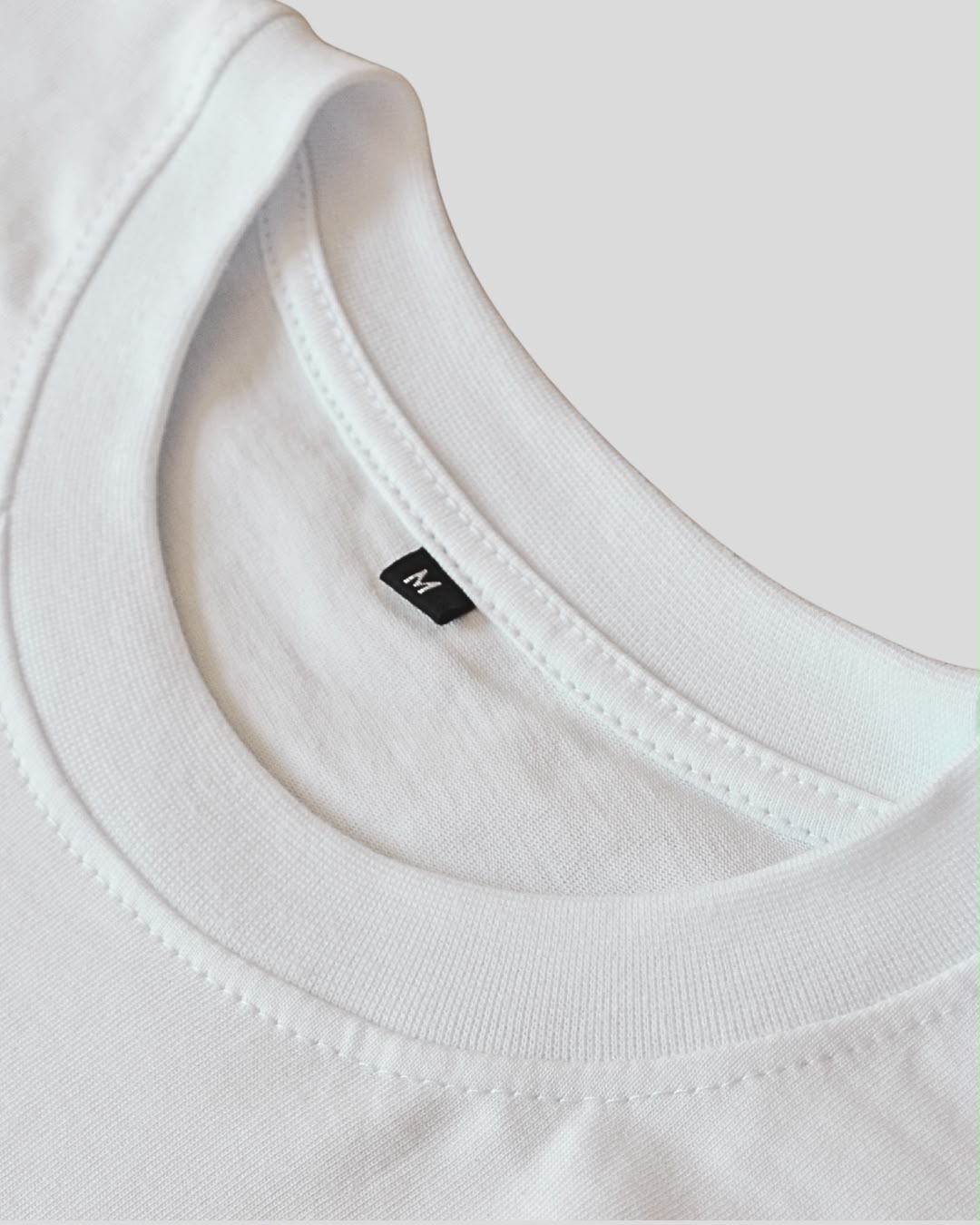Close-up of the collar on the white BP220 heavyweight cotton tee