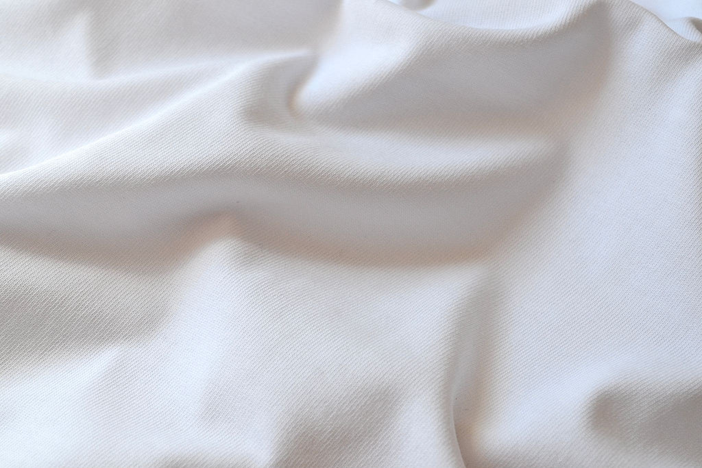 Close-up of the 220 GSM 100% cotton jersey fabric, white