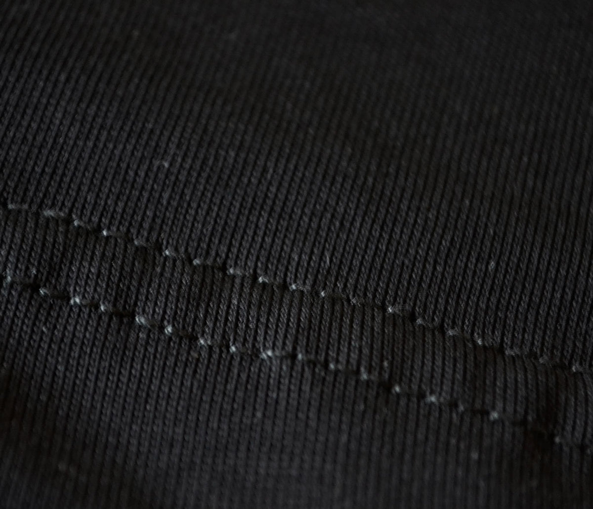 Close-up of the neat stitching on the black BP220 heavyweight cotton tee