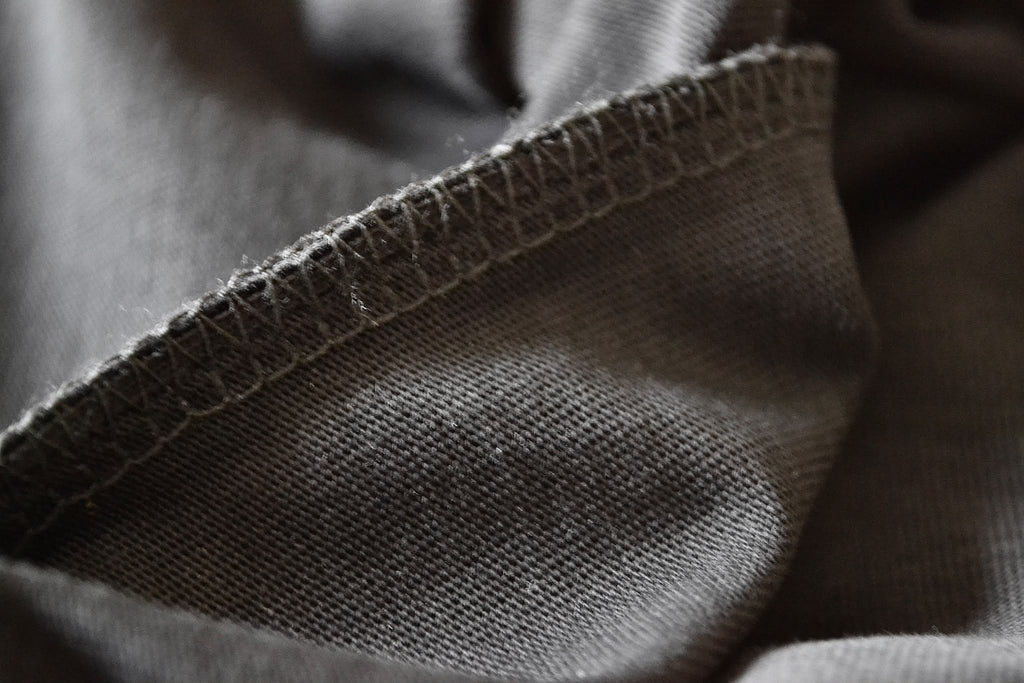 Hem and seam close-up on the black BP220 heavyweight blank T-shirt