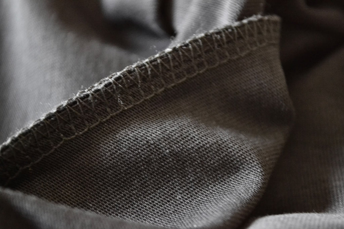 Hem and seam close-up on the black BP220 heavyweight blank T-shirt